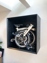 Load image into Gallery viewer, Additional front view of the Brompton Bicycle storage highlighting the offset bevel front face. and bicycle storage capability.